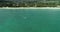 Aerial view of kite surfer in turquoise water