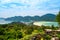 Aerial view of Ko Phi Phi islands, Thailand. Lookout from the viewpoint to tropical island, beach and ocean with long tail boats.