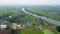 Aerial view of Kolakalur village surrounded with lush green paddy fields near Tenali town, Guntur district in India