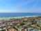 Aerial view of La Jolla coastline with nice small waves and beautiful villas.