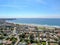 Aerial view of La Jolla coastline with nice small waves and beautiful villas.