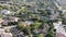 Aerial view of La Jolla little coastline city with wealthy villas and swimming pool.