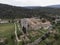 Aerial view of Lagrasse medieval city, Aude, Occitanie. the city is built along the river Orbieu