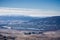 Aerial view of Laguna Lake, San Luis Obispo, California; the Pacific ocean coastline covered by a layer of fog in the background