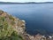 Aerial view of a lake with coastline stones and rocks