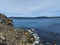 Aerial view of a lake with coastline stones and rocks