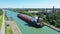 Aerial view of a Lake Freighter leaving a lock in the Welland Canal, Canada 4K