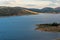 Aerial view of lake with hills on sunset