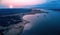 Aerial view of lake Kariba and surrounding landscape, in late evening with setting sun. Blue and pink colors. Zimbabwe wilderness