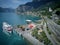 Aerial view of Lake Lucerne with a sightseeing boat cruising on the lake, railway tracks stretching along the shore