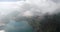 Aerial view of the lake Oeschinensee through the clouds. Swiss alps.