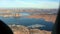 Aerial View of the Lake Powell with the house-boats marina and buttes on the shores