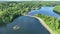 Aerial view lake road cars trees afternoon Tarrytown Lakes Park