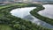 Aerial view of a lake separated by tree forest