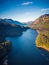 Aerial view of Lake surrounded by Trees and Mountains near Vancouver, BC, Canada