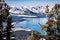 Aerial view of Lake Tahoe on a sunny winter day, Sierra mountains covered in snow visible in the background, California