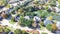 Aerial view lakeside houses with water fountain and colorful fall foliage in Coppell, Texas, USA