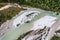 Aerial view of a landscape around a big river in a riverbed in mountain area,