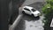 Aerial view landscape cityscape of Bangkok city and Thai people driving car on street road while raining storm and wind