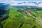 Aerial view landscape of Farm land fild in rural village mountains of asia with mist fog during morning time