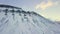 Aerial view of the landscape in Longyearbyen, Svalbard, Norway. Drone flight. Coal mining mountain.