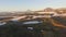 Aerial View. Landscape mountains. Flying grass and snow in the mountains