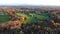 Aerial view of the landscape playing with all the colours of the autumn season during a warm sunset