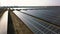 Aerial view Landscape of a solar plant that is located inside a valley flying over. Produces green, environmentaly