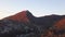 Aerial view - landscape of tree, mountain from the top of mountain in sunset time. Clip. Top view of the mountain city