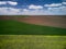 Aerial View of landscape with yellow rapeseed agricultural fields, springtime