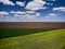 Aerial View of landscape with yellow rapeseed agricultural fields, springtime