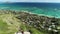 Aerial view of Lanikai beach, Honolulu, Hawaii, drone arc shot, people hiking to pill box world war II monument, color graded