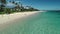 Aerial view of Lanikai beach, Honolulu, Hawaii, low angle view with drone camera moving forward, people on the shore, color graded