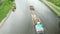 Aerial view of large cargo barge moving along the river. Cargo ship or tugboat transporting sand or raw material.