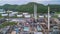 Aerial view of large fuel storage tanks at oil refinery industrial zone, White oil storage tanks farm.