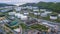 Aerial view of large fuel storage tanks at oil refinery industrial zone, White oil storage tanks farm.