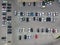 Aerial view of a large number of cars of different brands and colors standing in a parking