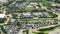 Aerial view of large parking lot with many parked colorful cars. Carpark at supercenter shopping mall with lines and