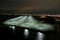 Aerial View of a Large Parking Lot Near A Busy Shipping Port