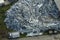 Aerial view of large pile of scrap aluminum metal from broken houses after hurricane Ian swept through Florida. Recycle