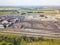 Aerial view of a large plant with mines for the extraction of coal. Mounds of black coal near production and industry