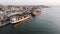 Aerial view of large ships moored to cargo port for loading