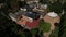 Aerial view of a large, three-story country house in Vallfogona, Spain