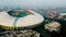 Aerial view - the largest stadium of Bekasi from drone. Indonesia. With smog pollution