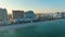 Aerial view of Las Olas Beach sandy surface with tourists relaxing at warm Florida sunset. Fort Lauderdale city with