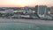 Aerial view of Las Olas Beach sandy surface with tourists relaxing at warm Florida suntet. Fort Lauderdale city with