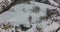 Aerial view with a lateral movement watching a totally snow covered field