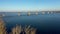 Aerial view of the left bank of the Dnieper city from the South bridge. Peeping from behind the trees.