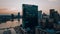 Aerial View of Legg Mason building and Baltimore Harbor next to it at sunset in the United States