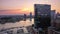 Aerial View of Legg Mason building and Baltimore Harbor next to it at sunset in the United States